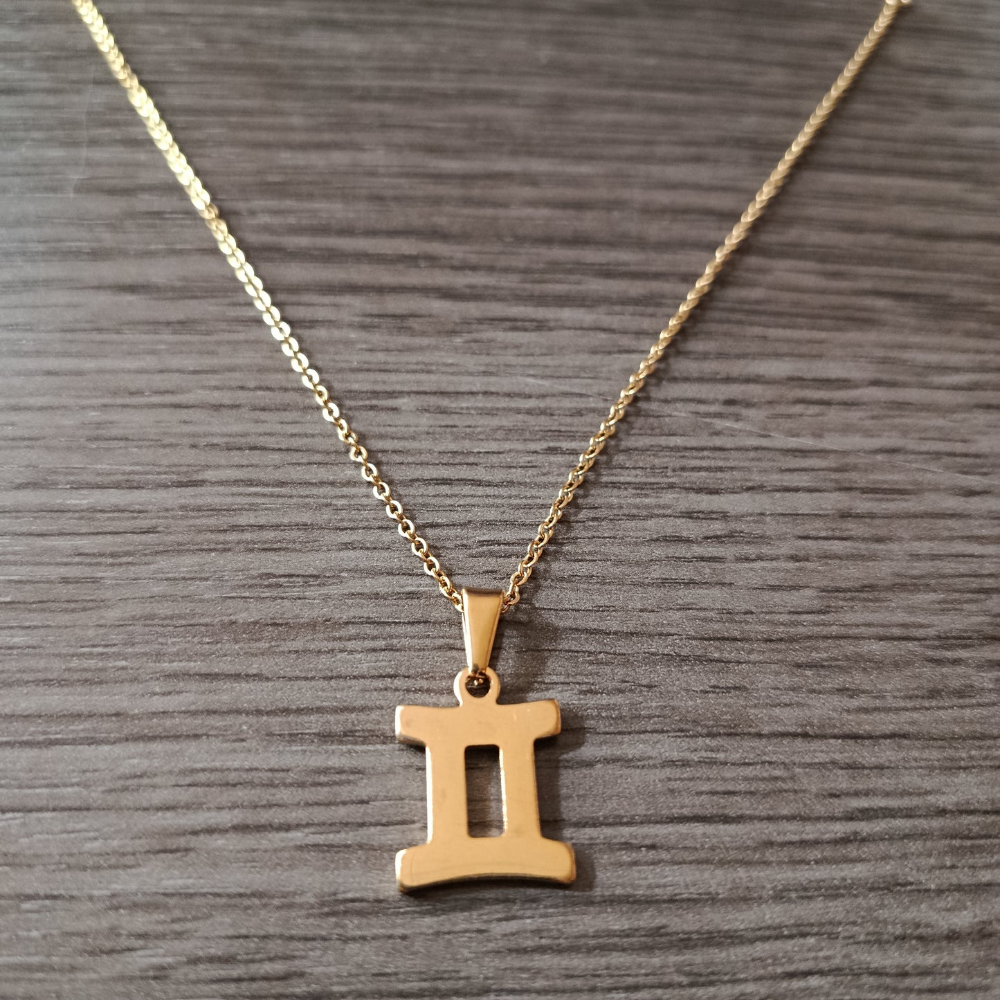 Collar acero dorado Geminis
