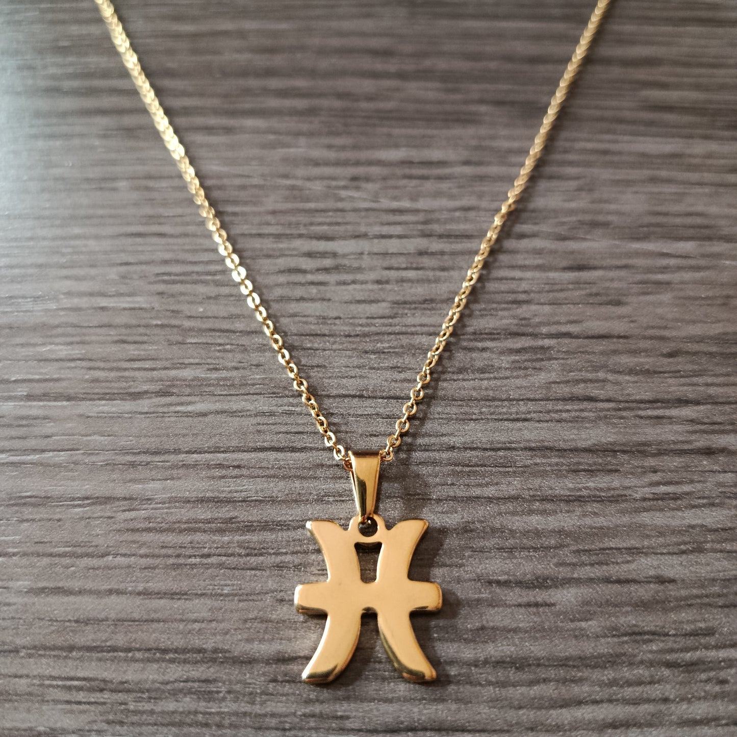 Collar acero dorado Piscis